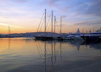 boat reflection in the sea with a colorful sunset 