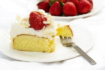 Strawberry cake with whipped cream and fresh strawberries  on white background