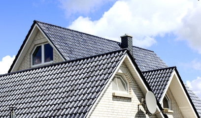 the roof of the house with nice window.