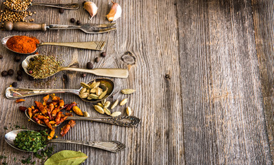 spices in the spoons on a table