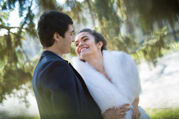 Portrait of happy wedding couple outdoors