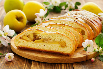 Apple pie dough with raisins in a roll.