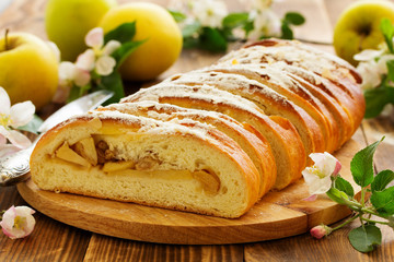 Apple pie dough with raisins in a roll.