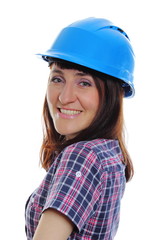 Smiling builder woman wearing protective blue helmet