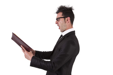 shocked businessman with book