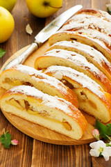 Apple pie dough with raisins in a roll.