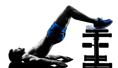 man exercising fitness crunches Bench Press exercises silhouette