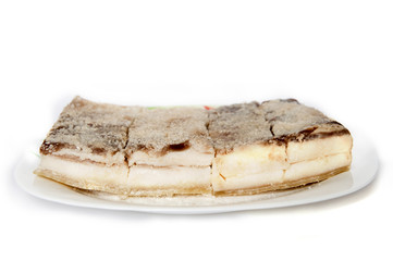 four pieces of salted bacon on a white background