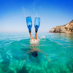 Diving. Women snorkeling in flippers beach islands. Girl dives - obrazy, fototapety, plakaty