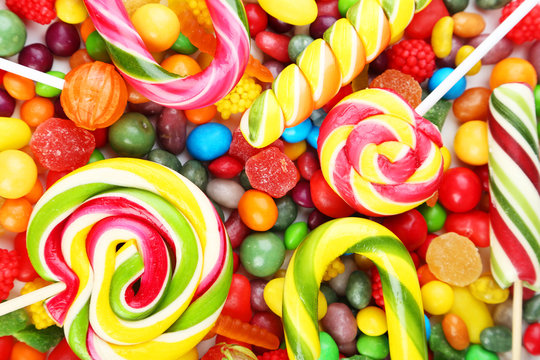 Different fruit candies background