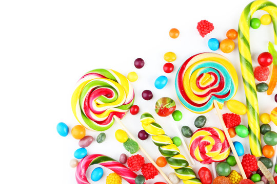 Different fruit candies on white background