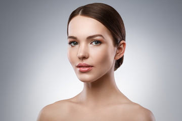 Fototapeta premium Young woman with beautiful face and soft skin