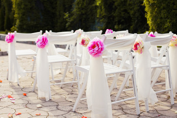 Decorations of wedding chairs, stylish marriage ceremony, bridal