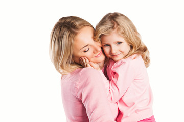 Portrait of happy embracing mother and daughter