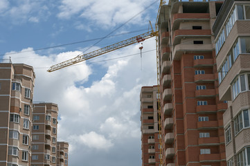 complex of houses, the tower crane on the sky background