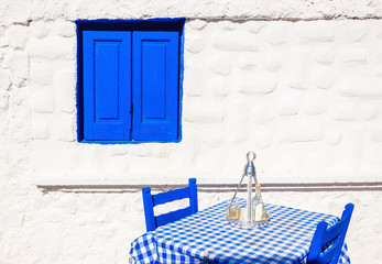 Greek restaurant with blue tablecloth, Greece - 84398776