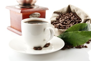 Cup of coffee with mill,bag full of coffee beans on white
