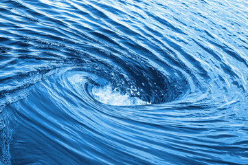 Huge whirlpool on a water surface - obrazy, fototapety, plakaty