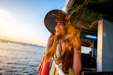 Woman enjoying the sea from ferry boat