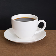Coffee cup and Coffee powder on wood
