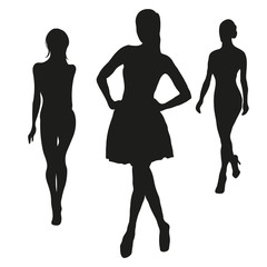 Three black silhouettes of women