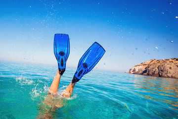 Flippers in water. Diver fins. Active vacation at sea. Diving. - obrazy, fototapety, plakaty