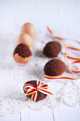 Chocolte easter egg cake baked in a shell tied with ribbon
