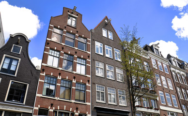 An old traditional oblique houses at the Begijnhof in Amsterdam