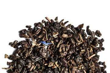 ..Aromatic black dry tea leaf with petals isolated on a white ba