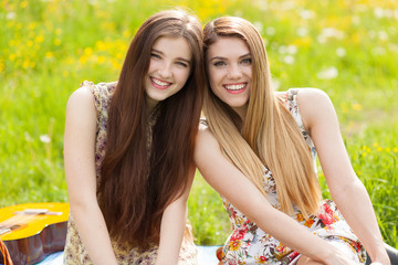 Two beautiful young women on a picnic