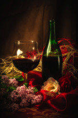 Glass and Bottle of Red Wine in Elegant Setting Under Soft Light