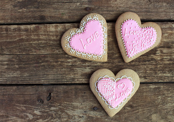 Gingerbread in the shape of heart with pink and white frosting