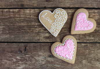 Gingerbread in the shape of heart with pink and white frosting
