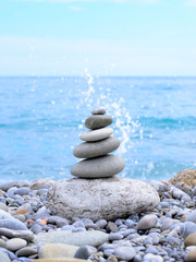 Stack of Stones Near the Beautiful Blue Ocean