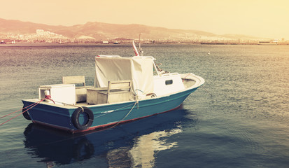 Naklejka premium Old wooden pleasure boat anchored in Izmir bay