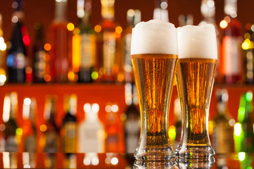 Jugs of beer served on bar counter