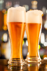 Jugs of beer served on bar counter
