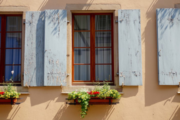 grey window shutter with flowers