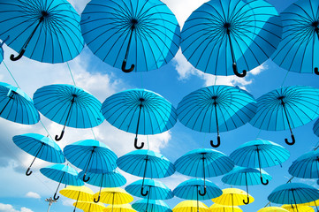 Fototapeta na wymiar Bright colorful umbrellas background