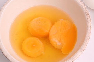 broken egg shells in a bowl on a white background selective soft focus