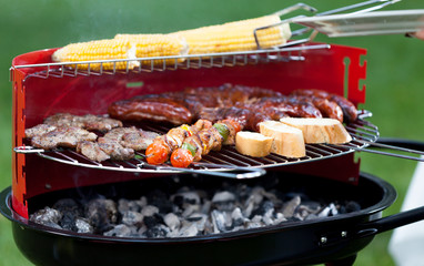 Meat and vegetables on grill