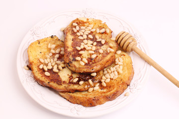 French toast with honey syrup croutons pine nuts breakfast sweet dessert selective soft focus