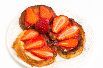 Breakfast French toast with strawberries isolated on white background