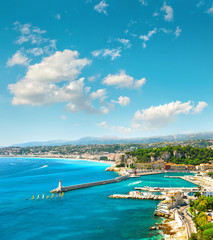 Fototapeta na wymiar Nice city, France. Azure sea water and perfect sunny blue sky