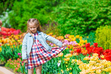 Spring garden, spring flowers - lovely girl and tulips