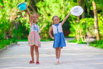 Adorable little girls during summer tropical vacation