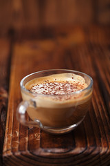 glass coffee cup on rustic textured wooden table