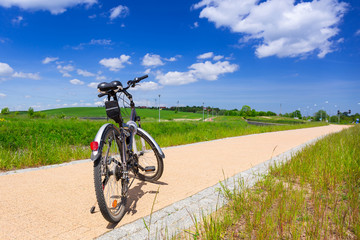 Fototapeta na wymiar Bike on the bicycle road at sunny day, Poland