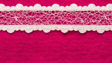 Vintage white lace over pink background