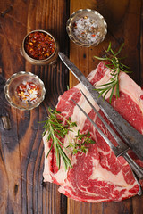 raw beef Ribeye  steak   on wooden  table